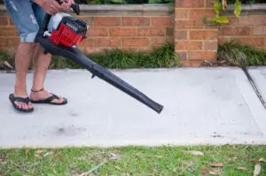 Man Using Battery Power Leaf blower